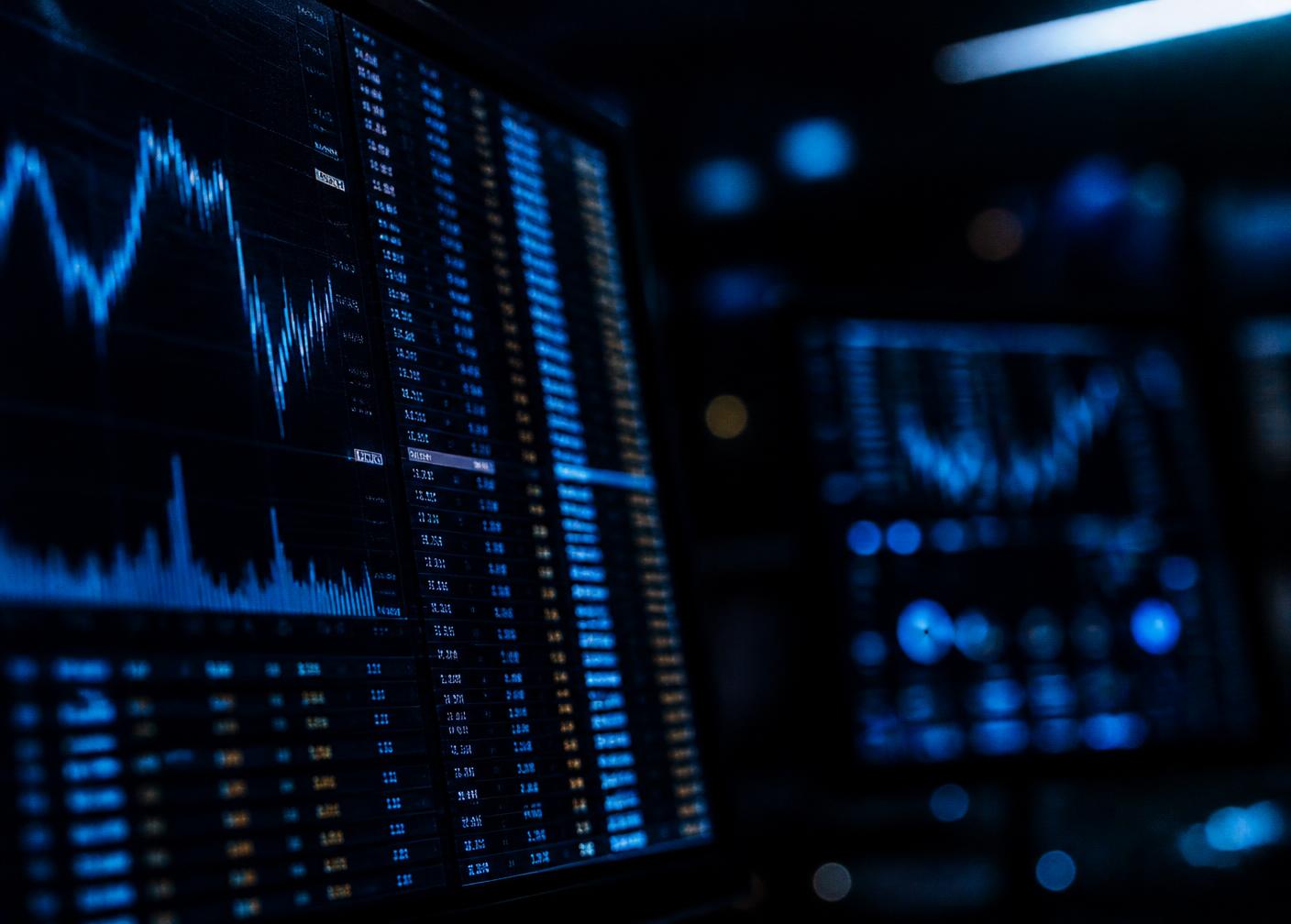 Financial market data screens showing pricing and transaction activity